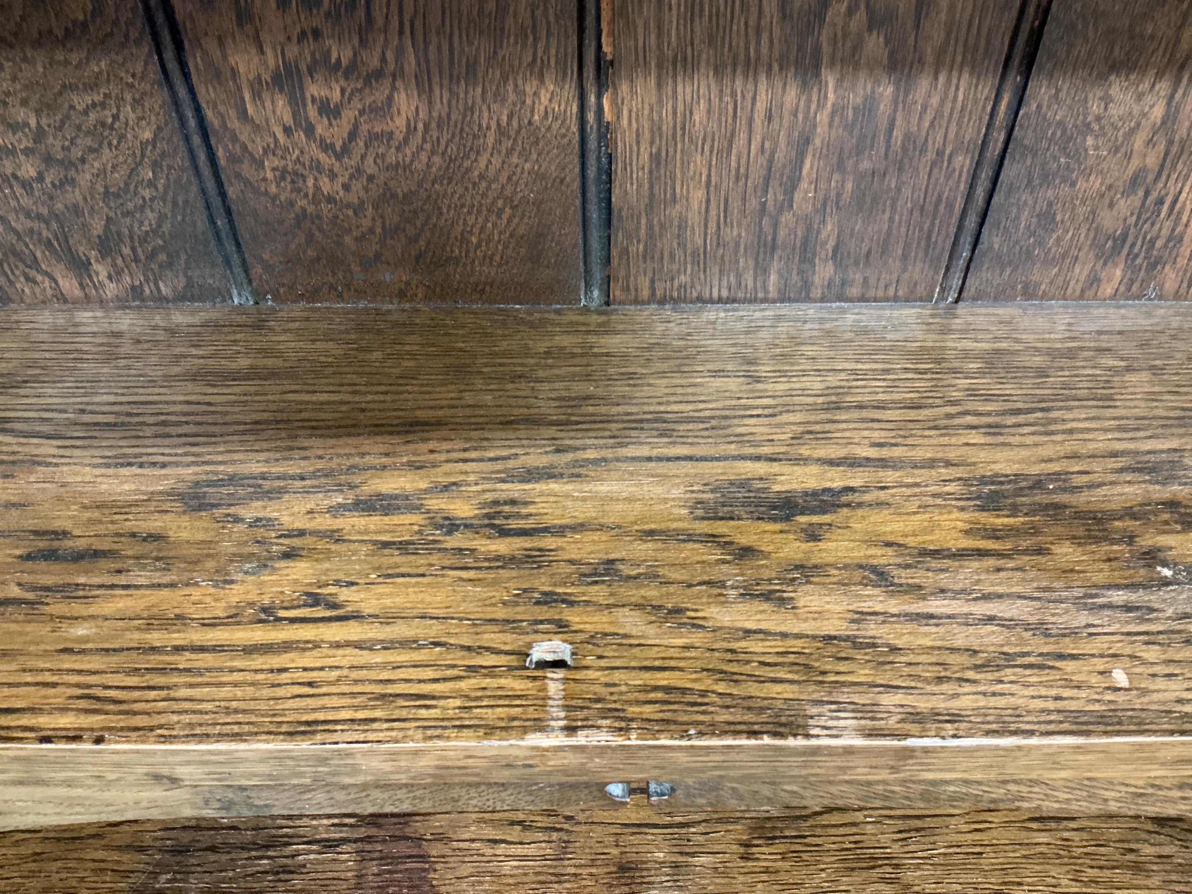 An Arts and Crafts brass mounted oak bureau bookcase, width 84cm, depth 38cm, height 185cm. Condition - fair